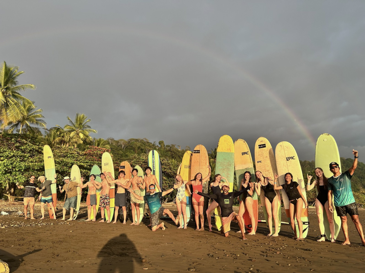 Convent and Stuart Hall pose after surfing in Costa Rica. 